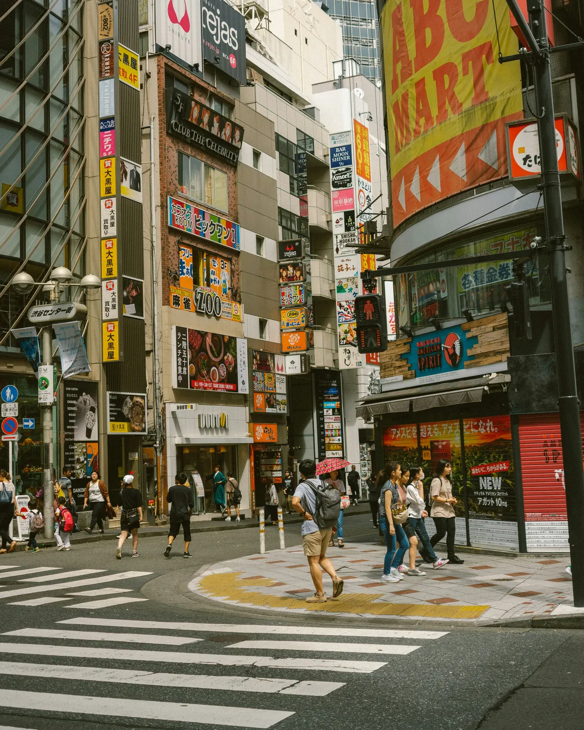 Busy shopping street with neon signs in Shinjuku, Tokyo, Japan